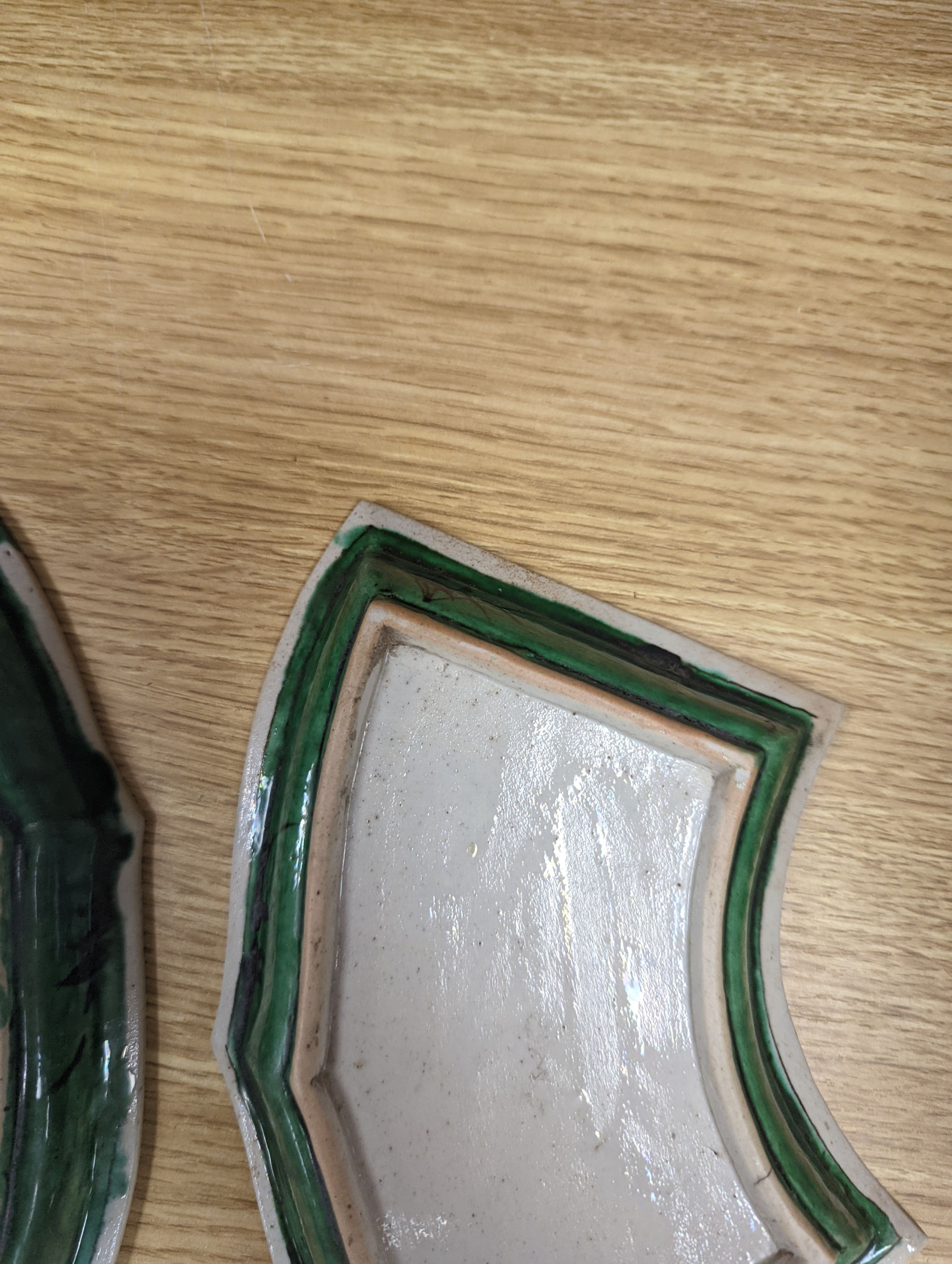 A pair of Chinese famille verte biscuit fan-shaped sweetmeat dishes, Kangxi, 20 cms wide.